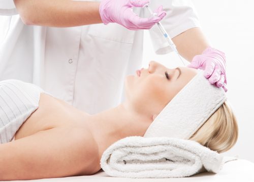 Portrait of a young woman on a botox injection procedure