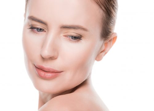 Woman with clean fresh skin isolated on white