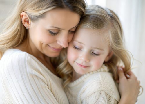 A tender moment, a hug between mother and daughter