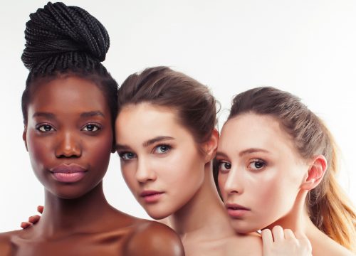 Photo of three different, diverse women