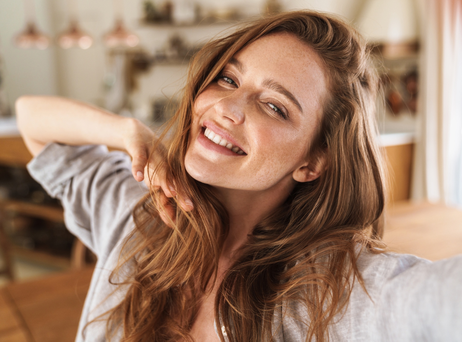 Picture of young smiling beautiful woman after CoolSculpting® for double chin treatments