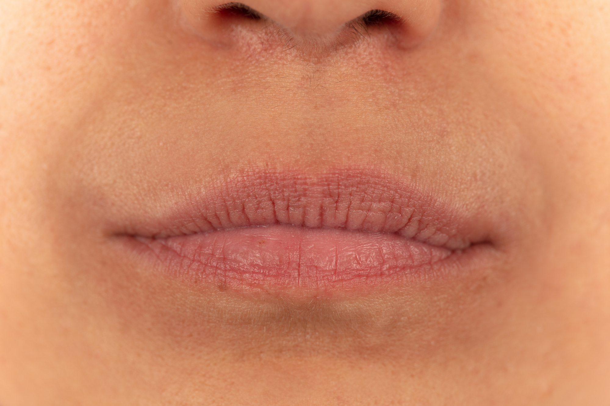 Close-up on a woman's thin lips